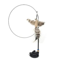 Flexible rod with a bird-shaped toy featuring fur and feathers, mounted on a suction cup base for hands-free cat play.