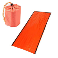 Compact emergency sleeping bag with orange drawstring pouch, ideal for outdoor survival and camping preparedness.