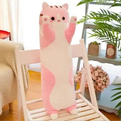 Cute Cat Pillow Plush Toy in pink and white, shaped like a cat with raised paws, placed on a white chair in a cozy room setting.