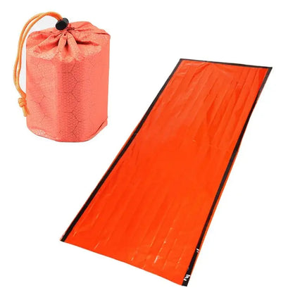 Compact emergency sleeping bag with orange drawstring pouch, ideal for outdoor survival and camping preparedness.