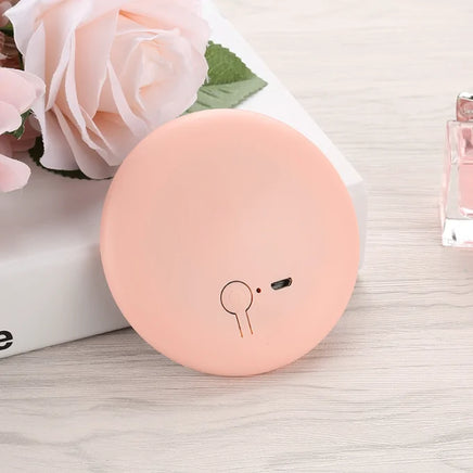 Pastel pink Pocket LED Makeup Mirror with a sleek and portable design, ideal for flawless makeup application anywhere.