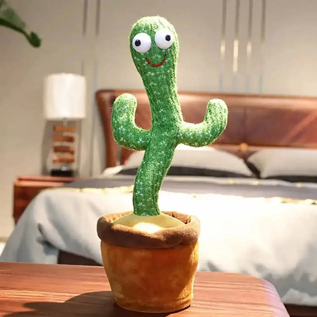 Dancing cactus toy in a brown pot placed on a wooden table in a cozy bedroom, showcasing its fun and interactive design.
