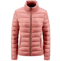Simple Women's Stand-up Collar Puffer Jacket in blush pink with horizontal quilting and front zip closure. A cozy, minimalist winter coat for women.
