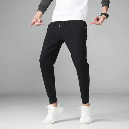 Crossfit Track Sweatpants in black, showcasing a slim-fit design with drawstring waist, ideal for gym and sportswear enthusiasts.