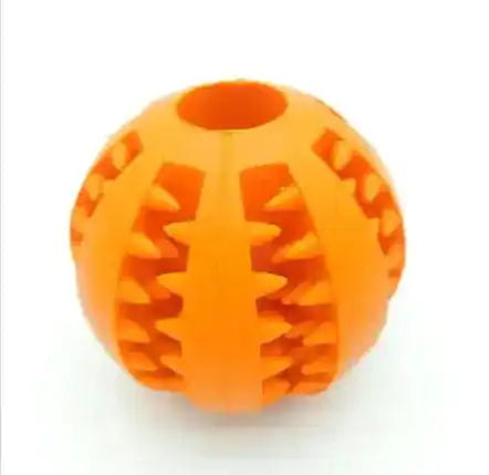 Orange interactive rubber slow feeder dog ball with textured grooves for treat dispensing and chewing fun.