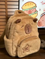 Side view of the Capybara Plush Little Backpack showcasing its soft plush texture, adorable capybara face, and spacious compartments.