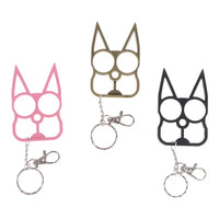 Three Portable Cute Cat Multifunction Outdoor Gadgets Keychains in pink, gold, and black shown with key rings and clips.