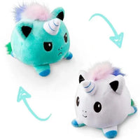 Green and white unicorn double-sided plush toy with reversible angry and happy expressions. Soft and fun from Shop Name.