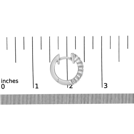 .925 sterling silver petite hoop earrings with 1/6 cttw diamonds shown next to a ruler for size reference.