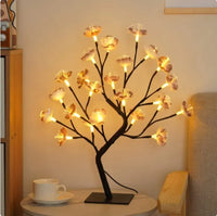 Romantic Rose Tree Lamp with delicate floral LED lights on black branches, perfect for creating a cozy and romantic atmosphere.