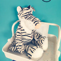 White and black striped tiger plush toy with a soft texture, perfect for baby and toddler playtime.