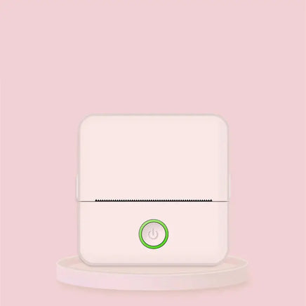 Minimalist pink portable thermal printer with a green power button, ideal for compact and stylish printing.