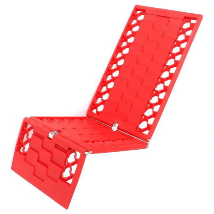 Foldable red car tire traction grip tracks with a durable design, ideal for emergency use in off-road or slippery conditions.