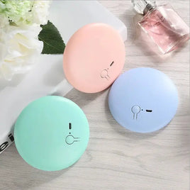 Set of three Pocket LED Makeup Mirrors in pastel pink, blue, and green colors, featuring a sleek design for portable beauty needs.