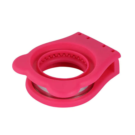 Compact pink stainless steel sandwich cut mold in a folded position, highlighting its portability and bear-shaped design.