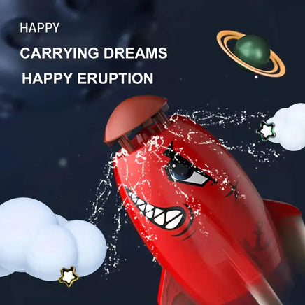 Red Rocket Launcher Toy with cartoon face design, spraying water and surrounded by playful space-themed graphics.