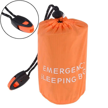 Close-up of the orange waterproof reusable emergency sleeping bag with a whistle attached to the black drawstring for added safety.