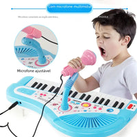 Child singing into the microphone of a blue 37-key electronic piano toy, showcasing interactive musical fun and cognitive dev